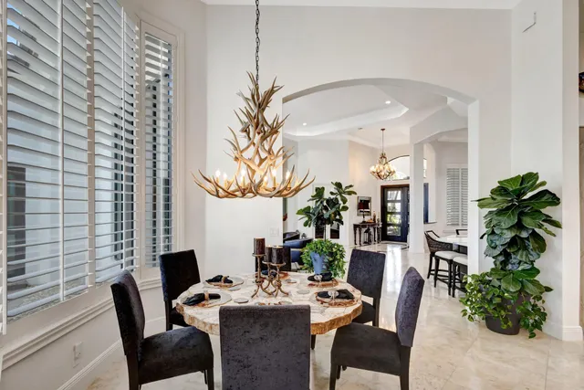 a view of a city with lots of residential buildings ocean and mountain view in back