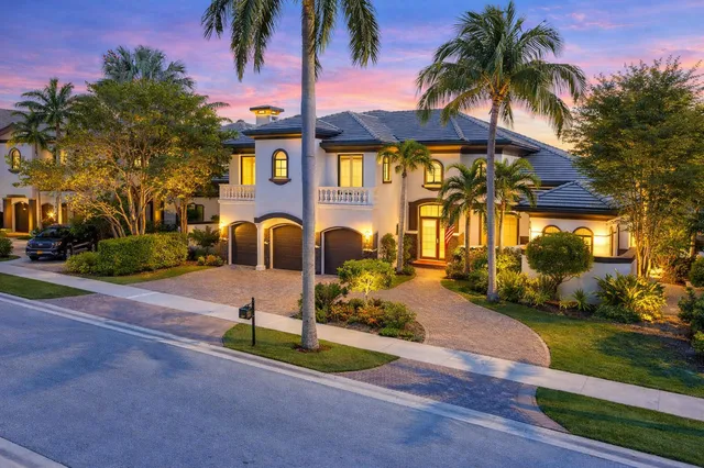 a kitchen with stainless steel appliances granite countertop a sink and a stove