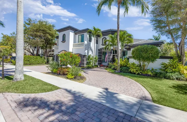a view of a dining room with furniture large windows and wooden floor