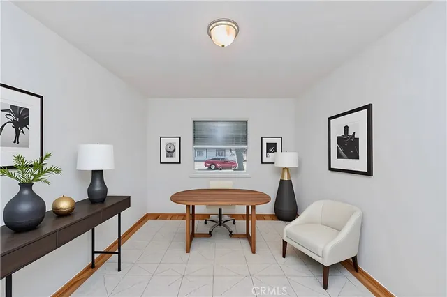 a living room with furniture and a lamp