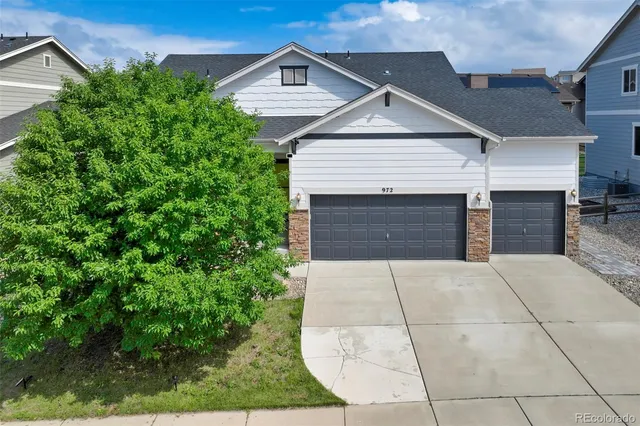 a front view of a house with garage