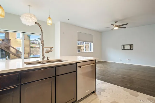 a kitchen with a sink and cabinets