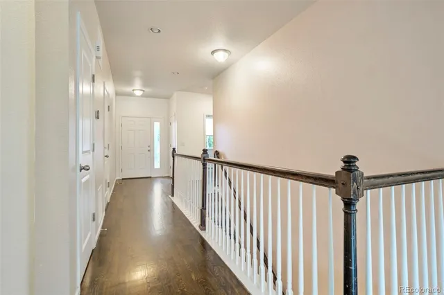 a view of a hallway with a dining room