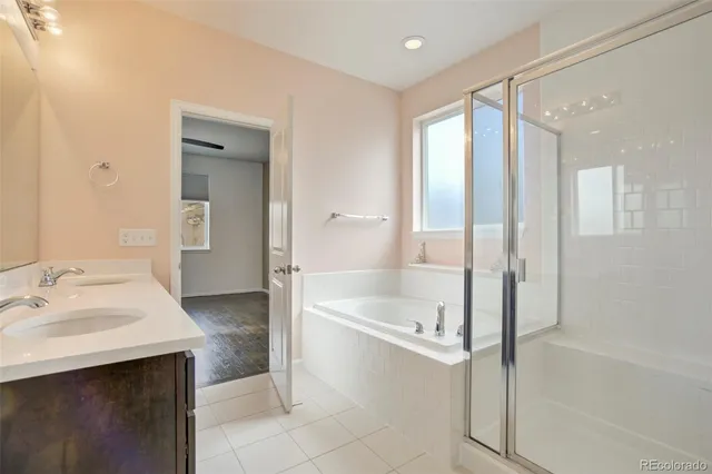 a bathroom with a bathtub and a sink