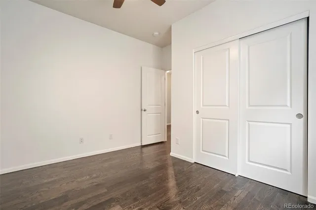 an empty room with wooden floor