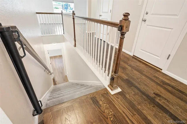 a view of an entryway with wooden floor