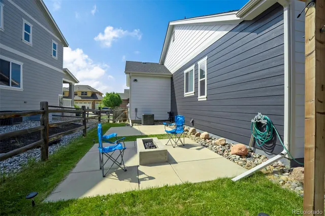 a view of backyard with sitting area