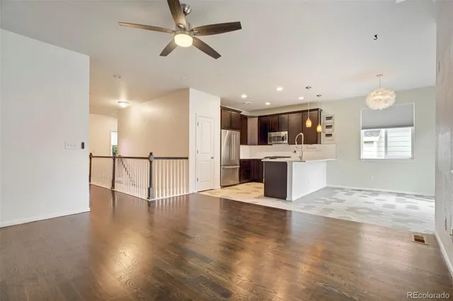 a view of a kitchen with a sink and a window