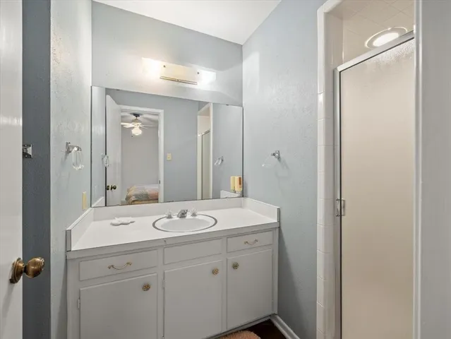 a bedroom with bed and a window