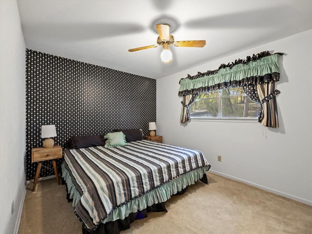 13030 Miller Road Azle, TX 76020 - Photo 22 of 40 a bedroom with bed and a window