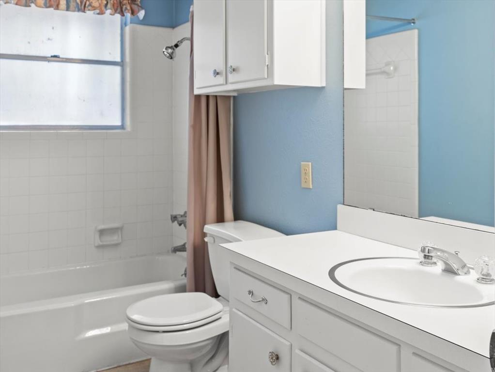 13030 Miller Road Azle, TX 76020 - Photo 25 of 40 a bathroom with a sink a toilet and shower