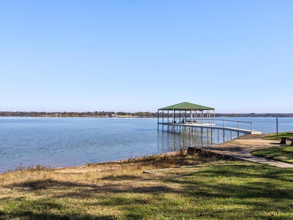13030 Miller Road Azle, TX 76020 - Photo 7 of 40 a view of a swimming pool with a lake view