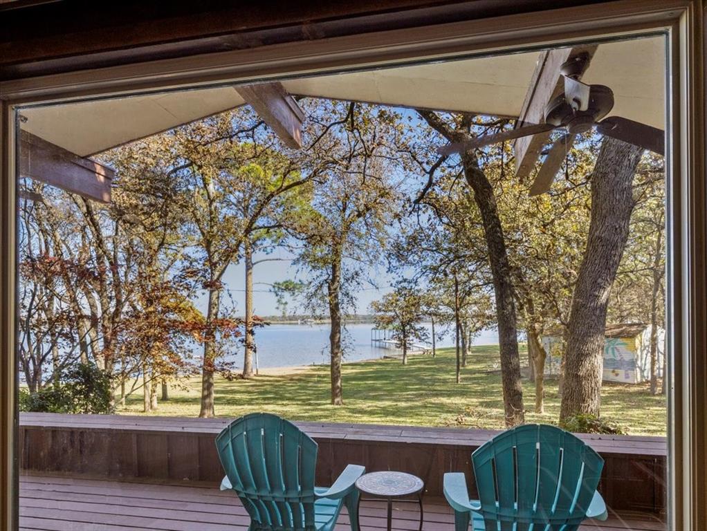 13030 Miller Road Azle, TX 76020 - Photo 8 of 40 a view of a porch with furniture and a yard