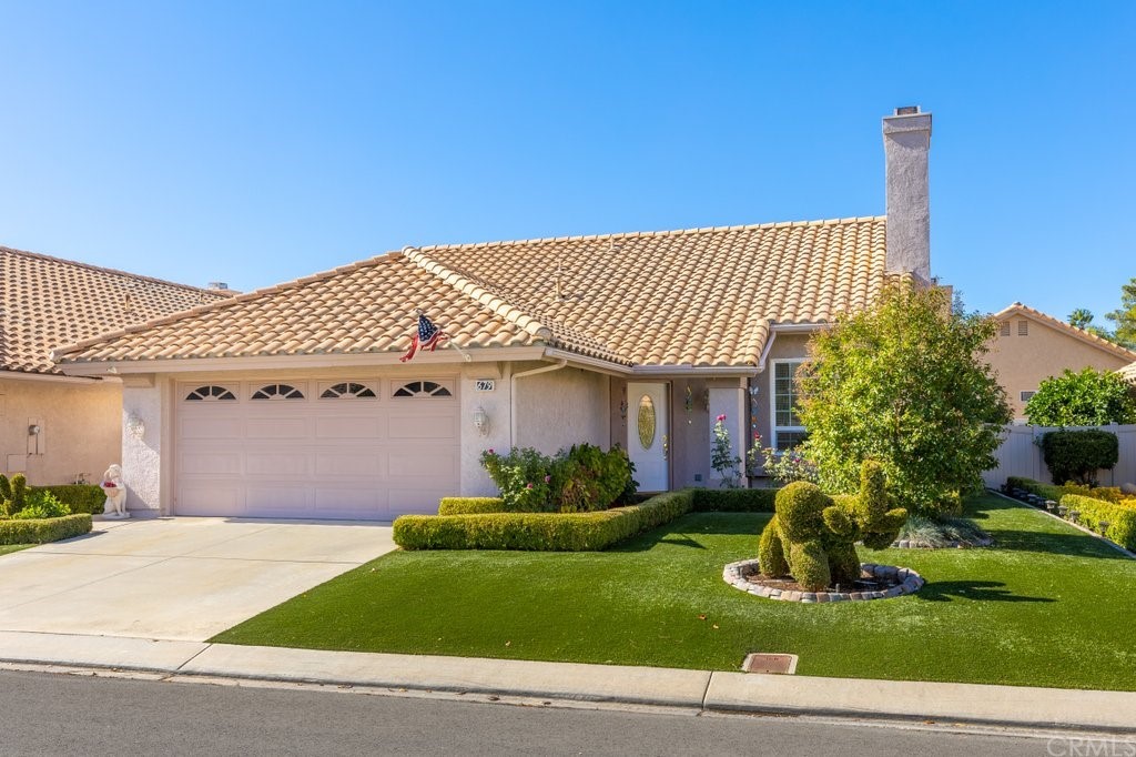 679 Torrey Pines Road Banning, CA 92220 - Photo 1 of 1 a front view of a house with garden
