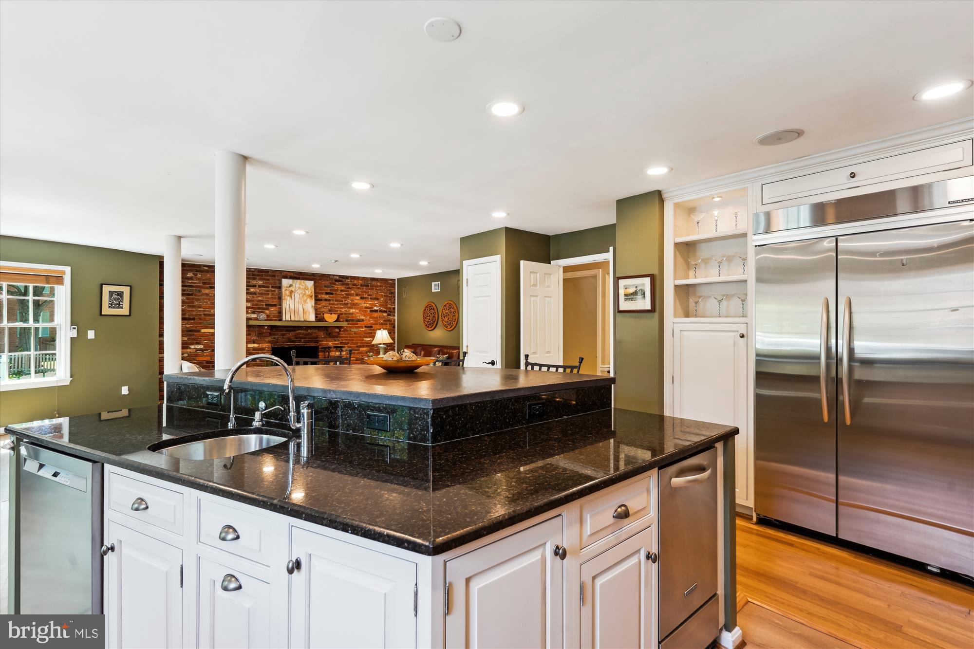 7101 Old Gate Road Rockville, MD 20852 - Photo 11 of 52 a kitchen with counter top space cabinets and stainless steel appliances