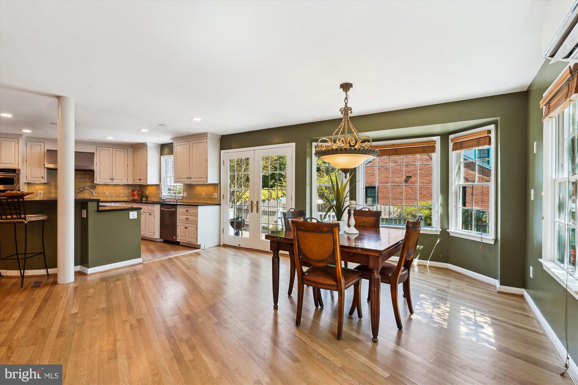 7101 Old Gate Road Rockville, MD 20852 - Photo 13 of 52 a view of a dining room and livingroom with furniture window and wooden floor