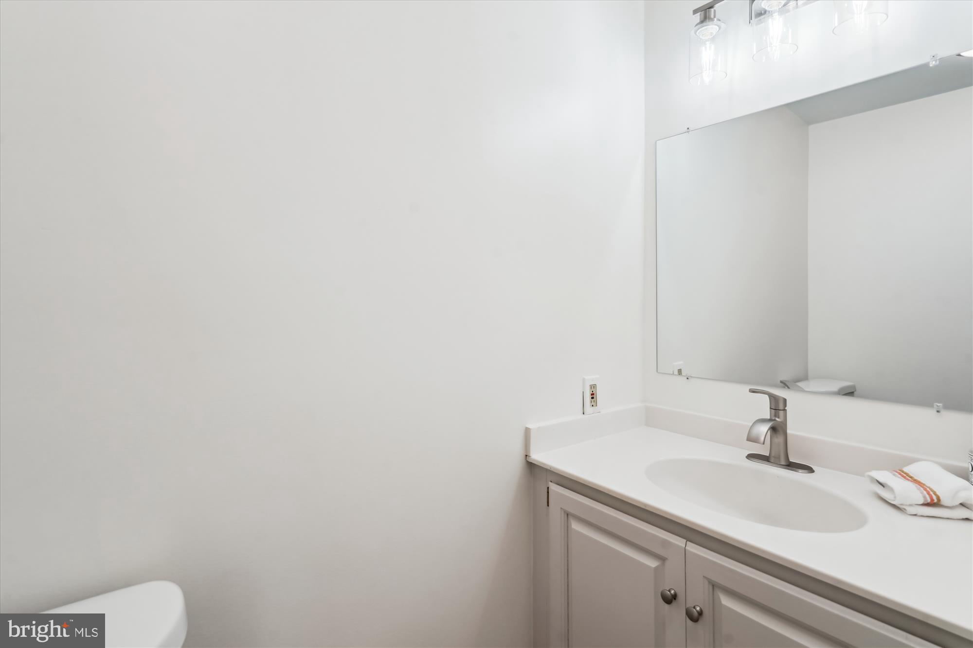 7101 Old Gate Road Rockville, MD 20852 - Photo 27 of 52 a bathroom with a sink and a toilet