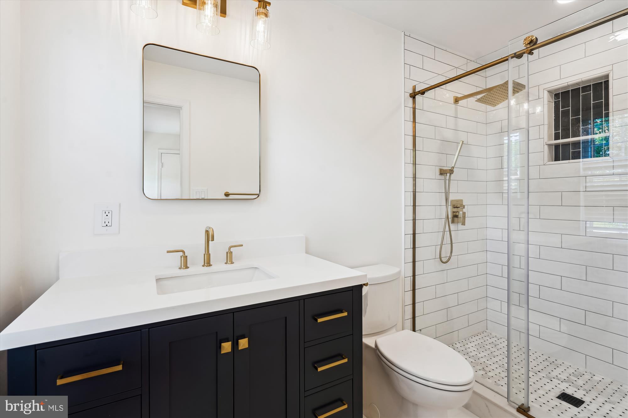 7101 Old Gate Road Rockville, MD 20852 - Photo 32 of 52 a bathroom with a toilet a sink a mirror a vanity and shower