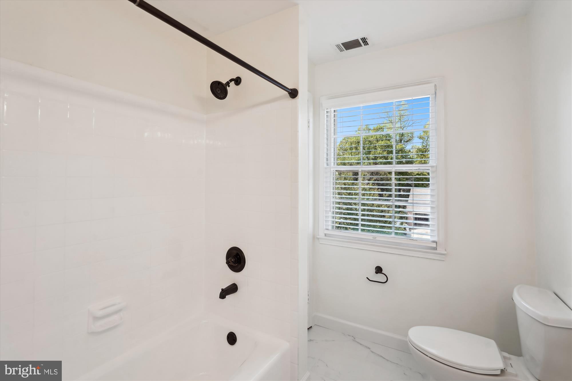 7101 Old Gate Road Rockville, MD 20852 - Photo 33 of 52 a bathroom with a bathtub shower