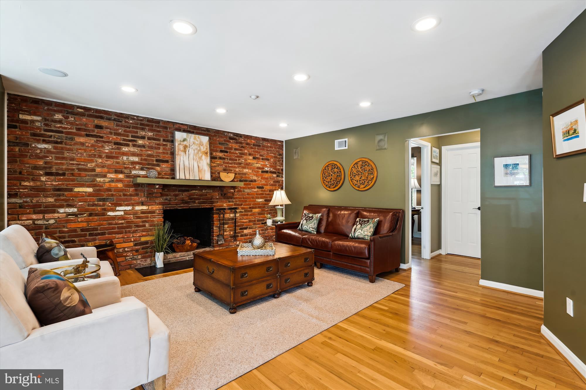 7101 Old Gate Road Rockville, MD 20852 - Photo 8 of 52 a living room with furniture and a fireplace