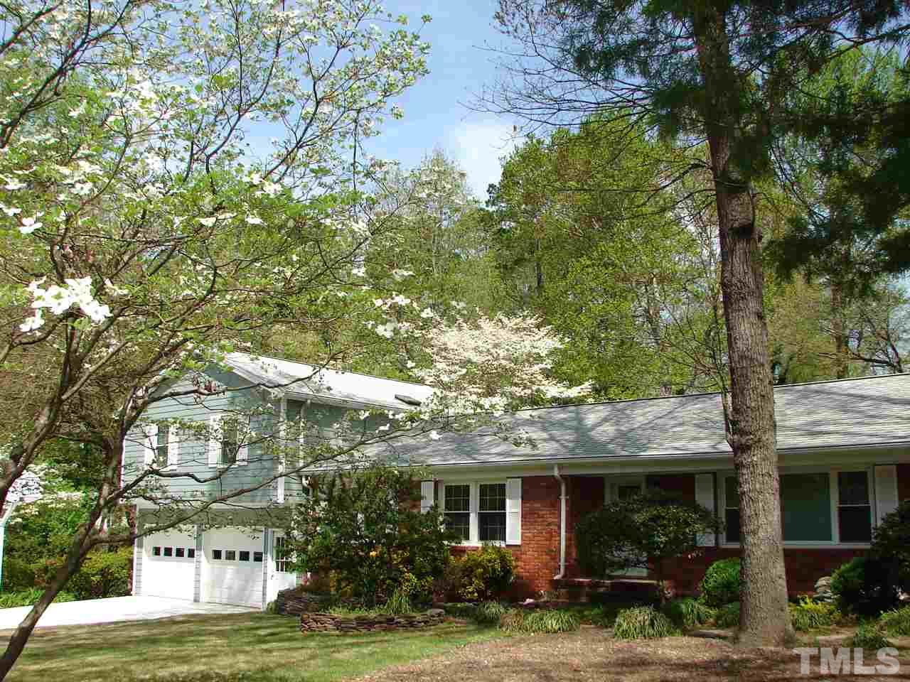 409 Vernon Terrace Raleigh, NC 27609 - Photo 2 of 23 Recently Re-Surfaced Driveway PLUS a Second Gravel Driveway on Right Side for Loads of Parking Options.
