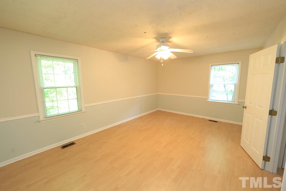 409 Vernon Terrace Raleigh, NC 27609 - Photo 12 of 23 Spacious Second Floor Bedroom or Use as A Bonus Room. Corner Bedroom Offers Two Windows and View of Backyard and Side Yard.