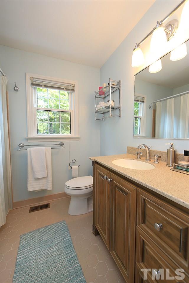 409 Vernon Terrace Raleigh, NC 27609 - Photo 14 of 23 Second Floor Full Bath with Tile Floor, Tub/Shower and Elongated Vanity.
