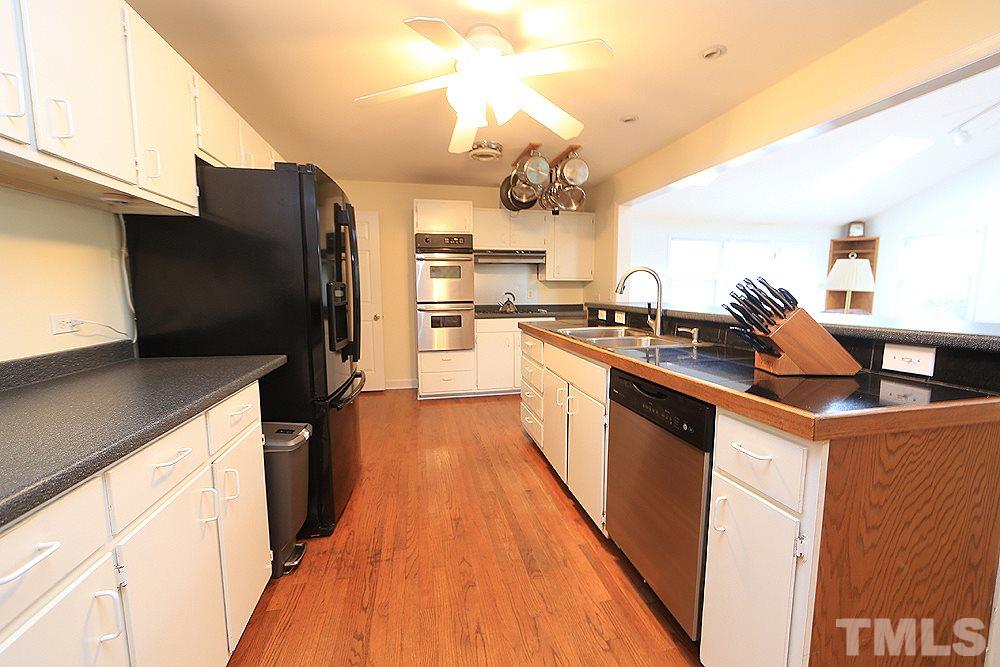 409 Vernon Terrace Raleigh, NC 27609 - Photo 5 of 23 Completely Open to the Great Room and Perfect for Hosting Holidays and Party's. Now Everyone can Enjoy one Another all Together ! Offers Plenty of Counter Space, Lots of Cabinets PLUS A Tiered Bar.
