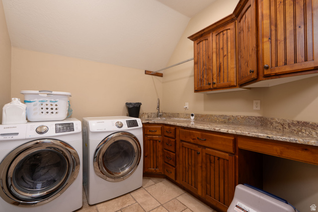 687 South 2080th Street East Springville, UT 84663 - Photo 57 of 149 Utility room featuring wood cabinetry, stone-finish countertops, and tile flooring
