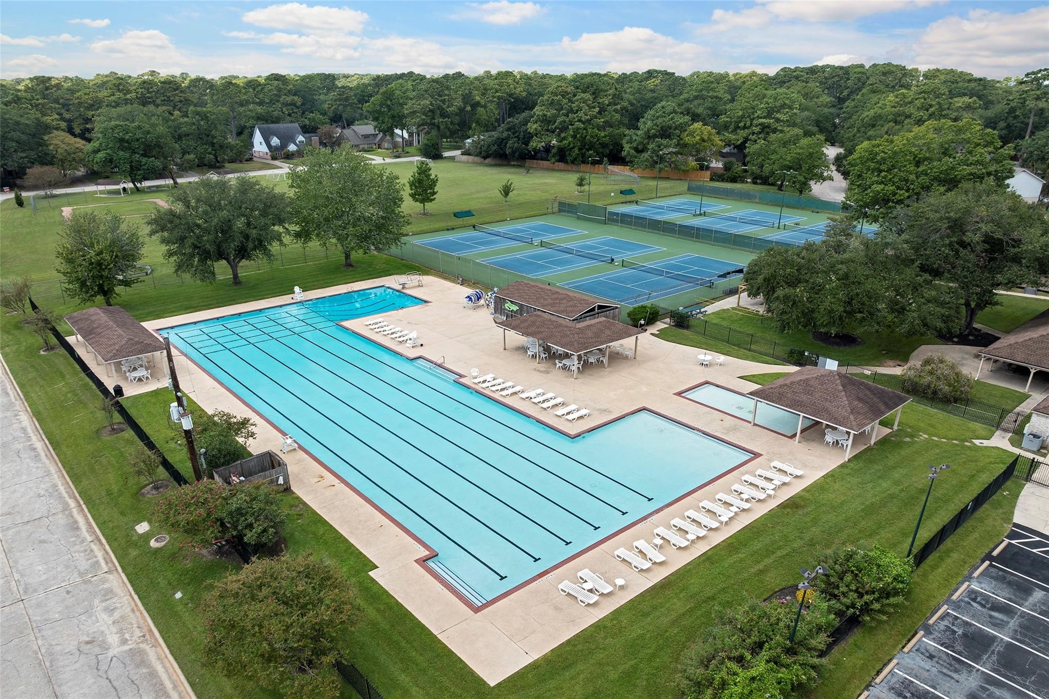 6507 Spring Leaf Drive Spring, TX 77379 - Photo 46 of 50 Spring Creek Forest neighborhood has a community swimming pool with an Olympic-sized pool, lap lanes, diving boards, a wading pool, and covered pavilions with ceiling fans and seating.
