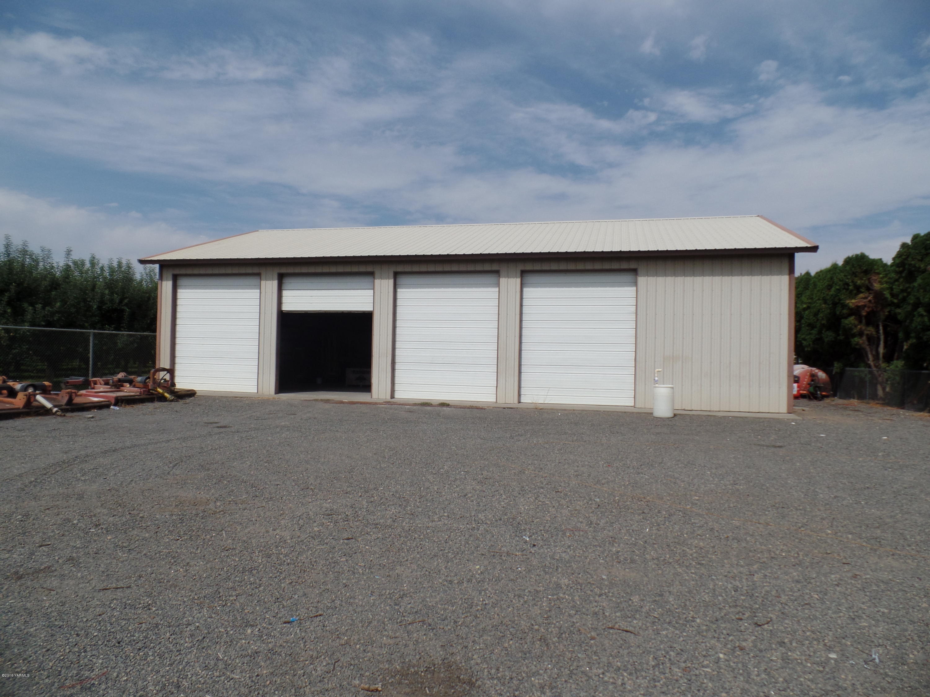2320 Lateral A Road Wapato, WA 98951 - Photo 3 of 5 a view of garage and car parked