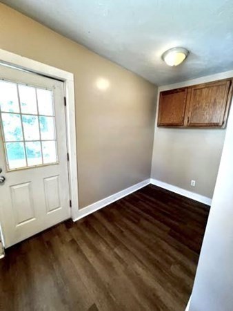 9 Castle Street Ware, MA 01082 - Photo 11 of 19 a view of an empty room with wooden floor and a window