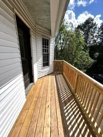 9 Castle Street Ware, MA 01082 - Photo 14 of 19 a view of balcony with wooden floor and outdoor space