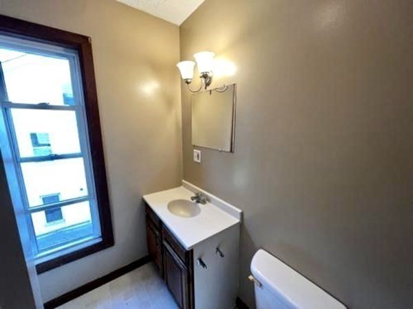 9 Castle Street Ware, MA 01082 - Photo 15 of 19 a bathroom with a sink a mirror and a toilet