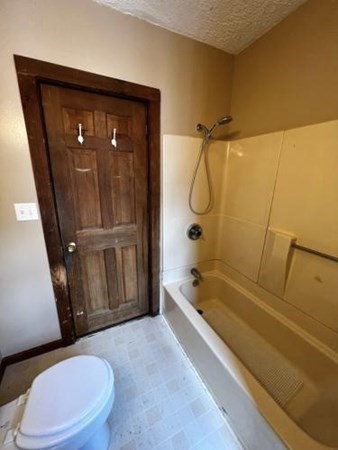 9 Castle Street Ware, MA 01082 - Photo 16 of 19 a bathroom with a granite countertop bathtub shower sink vanity and toilet