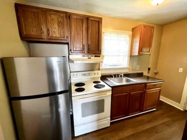 9 Castle Street Ware, MA 01082 - Photo 18 of 19 a kitchen with a refrigerator sink stove and cabinets