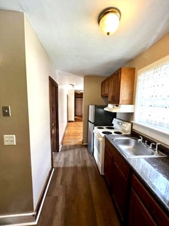 9 Castle Street Ware, MA 01082 - Photo 19 of 19 a kitchen with stainless steel appliances granite countertop a sink stove and refrigerator