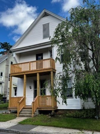 9 Castle Street Ware, MA 01082 - Photo 2 of 19 a front view of a house with a yard