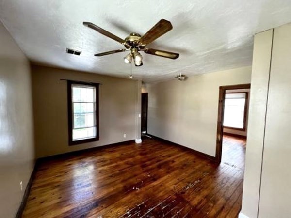 9 Castle Street Ware, MA 01082 - Photo 7 of 19 a view of an empty room with window and wooden floor