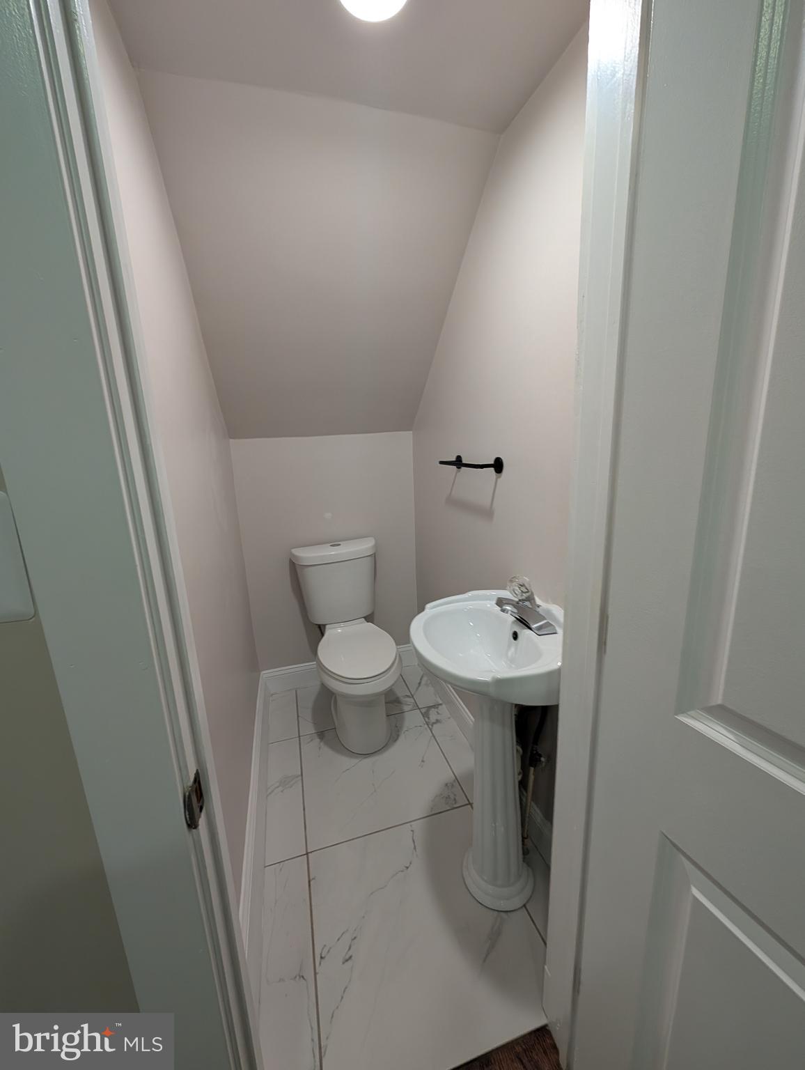 11926 Bluhill Road Silver Spring, MD 20902 - Photo 7 of 27 a bathroom with a sink and a toilet