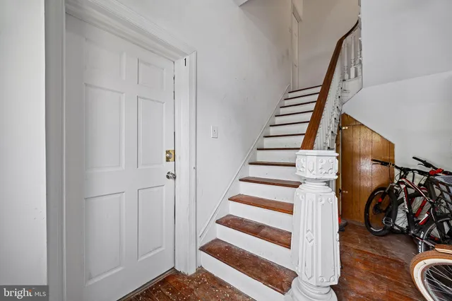 a view of a room with stairs and a workspace