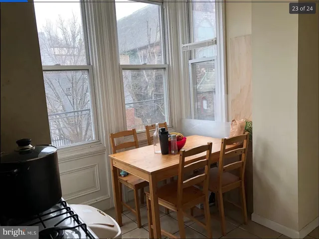 a utility room with dryer washer and a window
