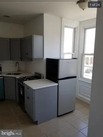 a kitchen with a stove and a microwave
