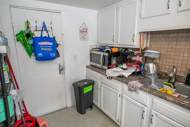 a bedroom with a bed and with cabinets