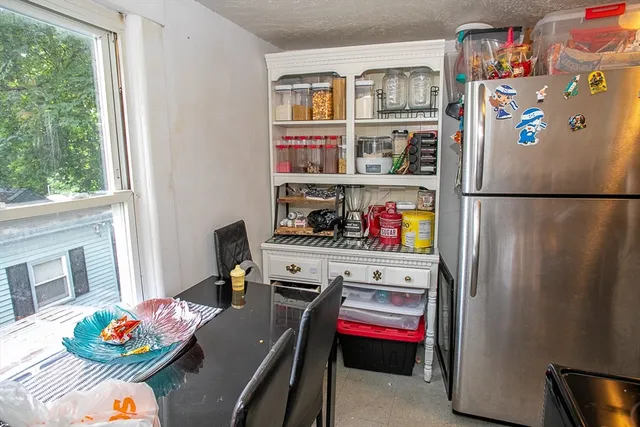 a bed room with a bed and a dresser