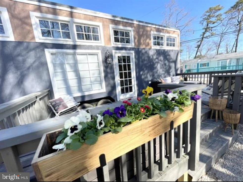 561 Corsons Tavern Road, Unit 43 Ocean View, NJ 08230 - Photo 4 of 18 a view of a chairs and table in the patio