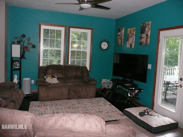 6570 West Cook Road Lena, IL 61048 - Photo 15 of 58 a living room with furniture and a flat screen tv