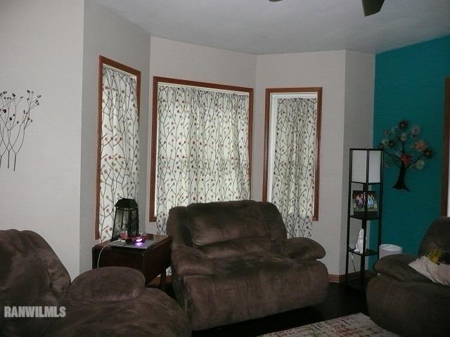 6570 West Cook Road Lena, IL 61048 - Photo 16 of 58 a living room with furniture and a large window