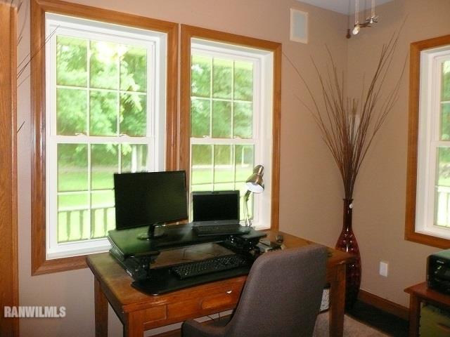 6570 West Cook Road Lena, IL 61048 - Photo 19 of 58 a living room with furniture and a flat screen tv
