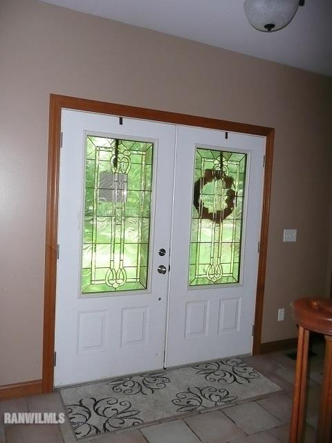 6570 West Cook Road Lena, IL 61048 - Photo 3 of 58 an empty room with windows